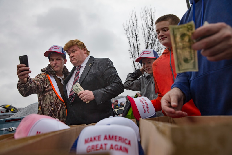 Trump supporter takes a selife with salesman Tim Stevens outside the Savannah Center in West Chester, Ohio on March 13, 2016 (AP)